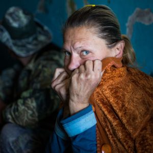 During shelling Irina has to hide in the only concrete building in the area - a condo near Donetsk airport.  The condo is also used by separatist fighters as a command post and firing position