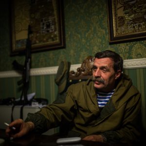 Igor Bezler also known as "Bes", a rebel field commander, 
smokes inside his office in Gorlovka, 
Donetsk region, Ukrane