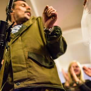 Igor Bezler also known as "Bes", a rebel field commander, 
dances with the bride holding his AK assault rifle 
at the wedding of his unit members in Gorlovka,
 Donetsk region, Ukrane