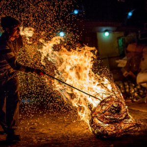 Raush, a refugee from Nagorno-Karabakh, burns cables at a scrap metal shop.