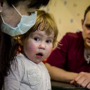 2 yo Katya is attending a cerebral palsy therapy in Radimichi NGO office in Novozybkov in Western Russia