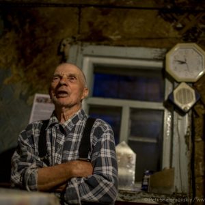 Leonid Ryndyuk, 87, a Chernobyl zone returnee is talking in his house in Chernobyl town, Ukraine
