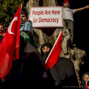 Muslim women are holding Turkish flags as they gather in front the President's house in Uskudar district of Istanbul, Turkey. Pro-Erdogan crowd waves flags and chants until early morning during the celebrations of the failed coup attempt