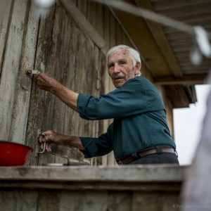 Prokopyev unlocking the “official” half of the airport building. The former pilot was tasked with managing the airport after he retired from flying. When the airport ended its operations back in the mid-'90s, his job was downgraded to night watchman.