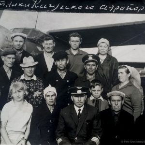 Vladimir (center front) with airfield staff in his piloting days. In the background is one of the Soviet AN-2 biplanes that serviced Prokopyev's airport. He finished his career flying the Tupolev TU-104, one of the world's first passenger jets.